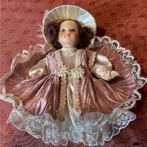 Vintage Porcelain Doll with Pink Dress